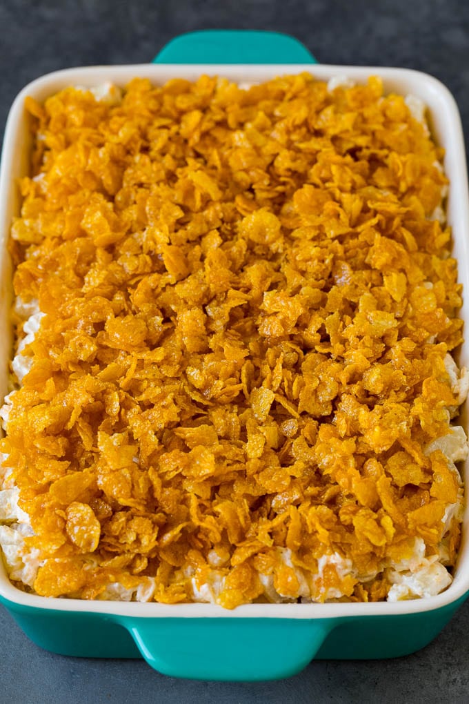 A dish of cheesy potatoes topped with cornflakes.