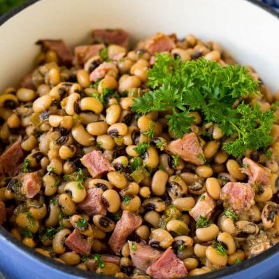 A pot of Hoppin' John made with stewed black eyed peas, ham and vegetables.