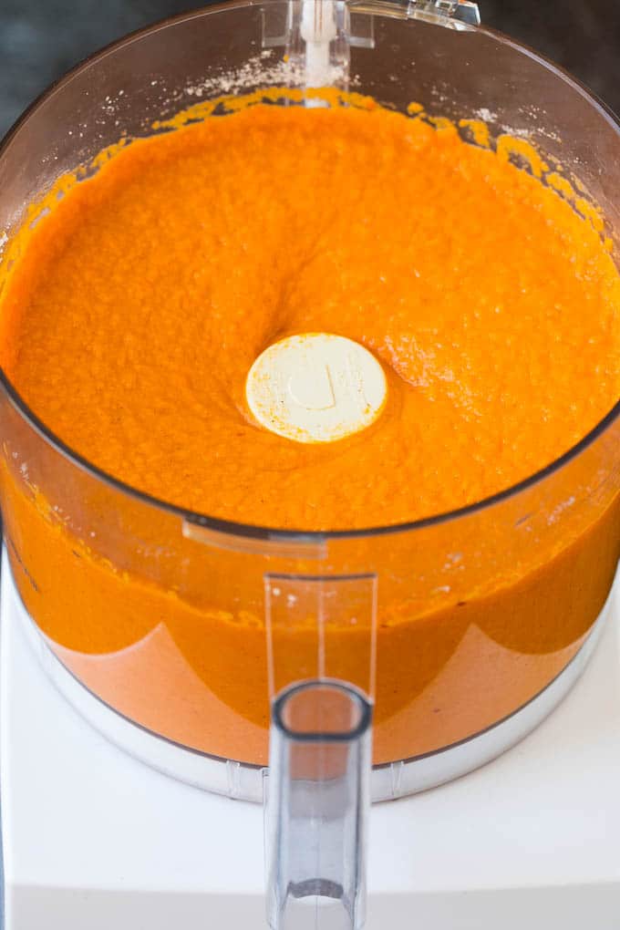 Sweet potato puree in the bowl of a food processor.
