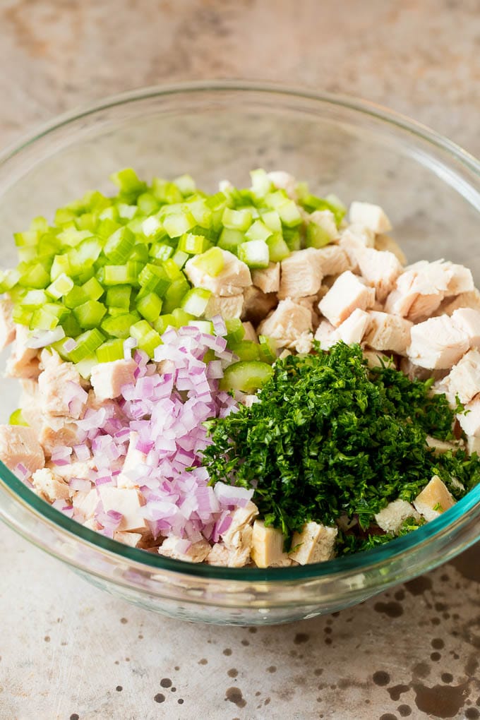 Turkey, vegetables and parsley in a bowl.