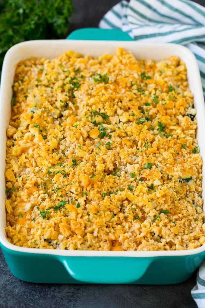 This zucchini casserole is sauteed squash tossed in a creamy sauce with plenty of cheese, all topped off with cracker crumbs and baked to perfection. A dish topped with crushed cracker crumbs.
