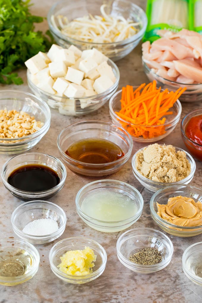 Bowls of ingredients including sauces, seasonings and vegetables.