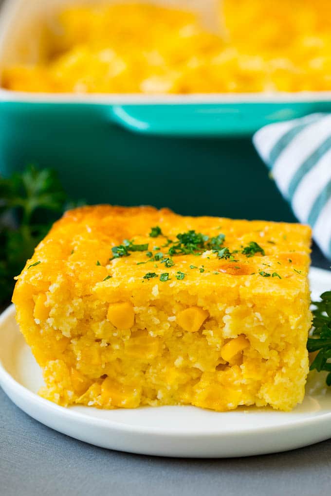 A slice of corn souffle on a plate.