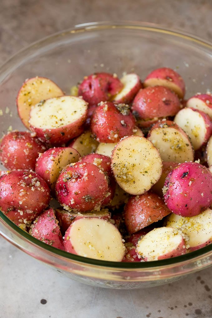 Cut potatoes tossed in olive oil and herbs.
