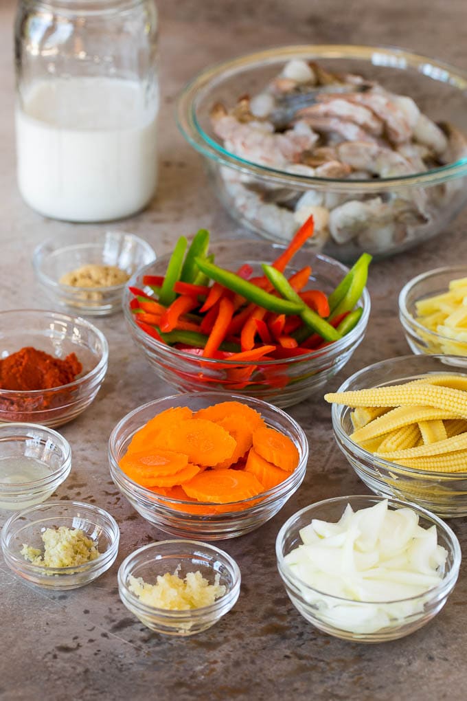 Bowls of ingredients including shrimp and assorted vegetables.