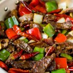 Szechuan beef with peppers, onions and spices.