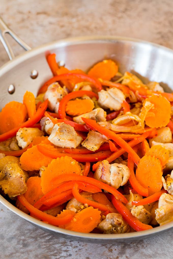 Sauteed chicken, carrots and bell peppers.