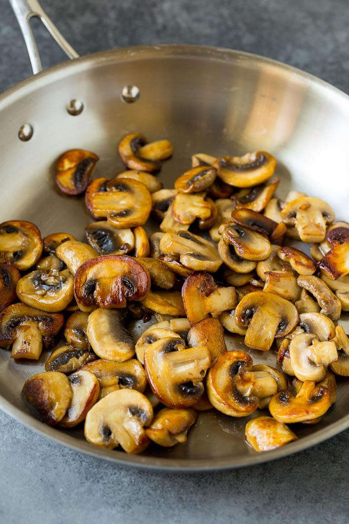 Sauteed mushrooms in a skillet.