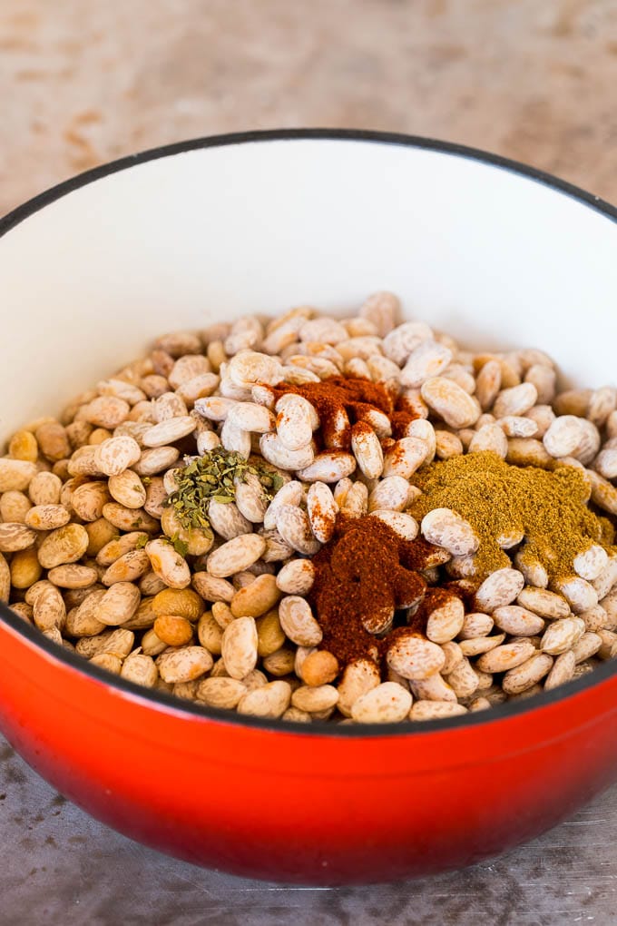 Pinto beans in a pot with spices.