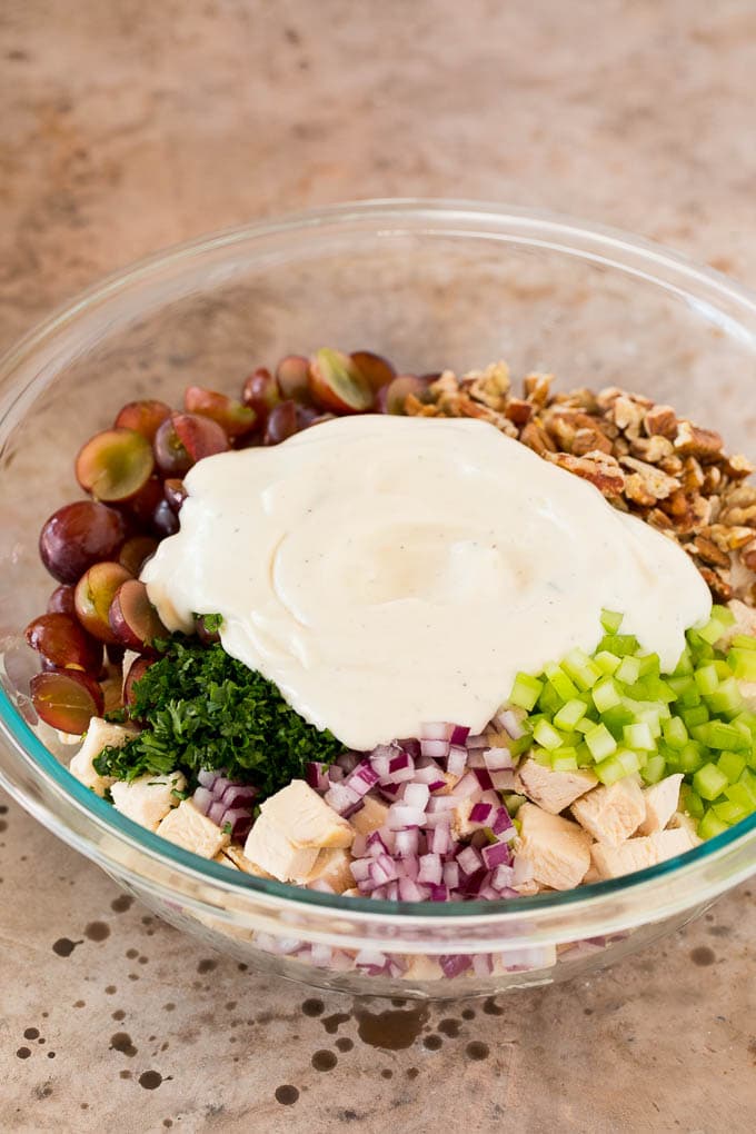 Creamy dressing poured over diced chicken and vegetables.