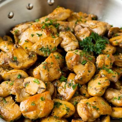 Garlic butter chicken and mushrooms topped with parsley.