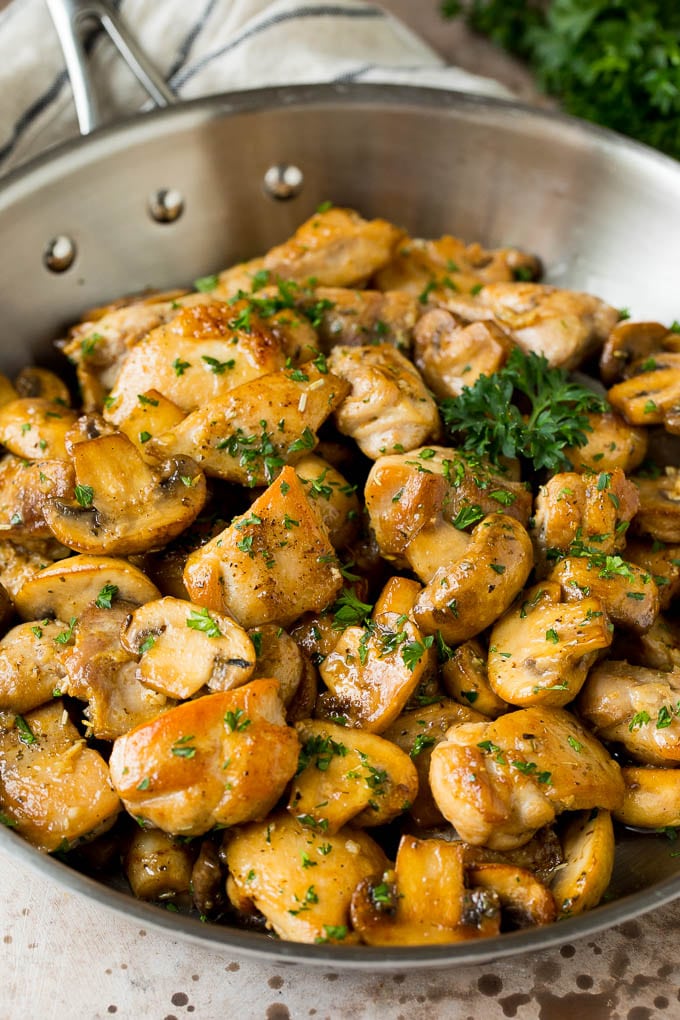 Garlic butter chicken and mushrooms topped with parsley.