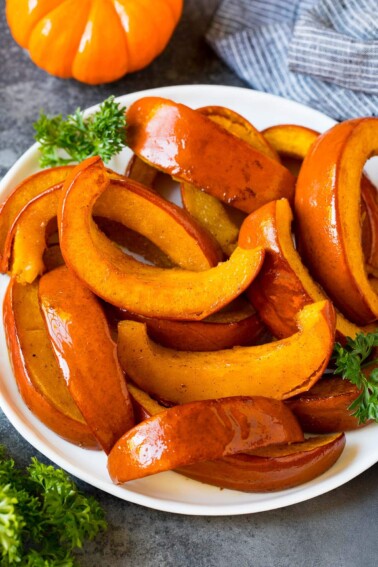 Slices of roasted pumpkin on a serving plate.