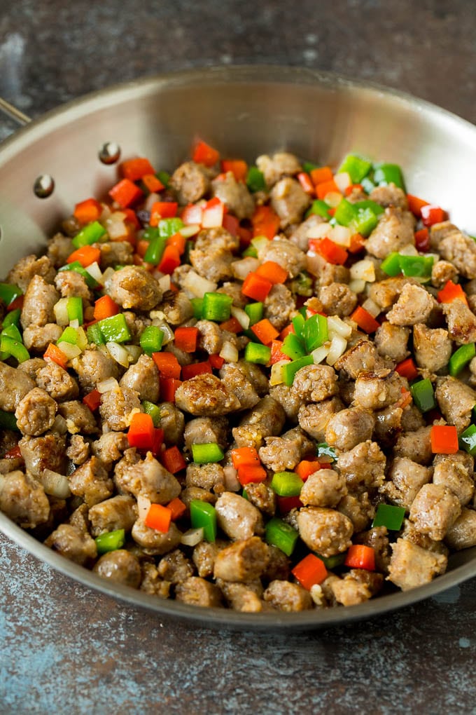 Sausage, peppers and onions in a skillet.