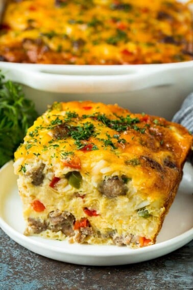 A piece of sausage casserole filled with hash browns, eggs and cheese.