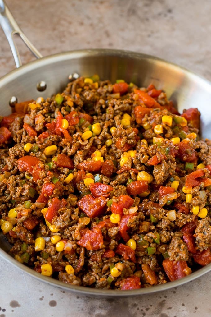 A mixture of ground beef and vegetables in a pan.