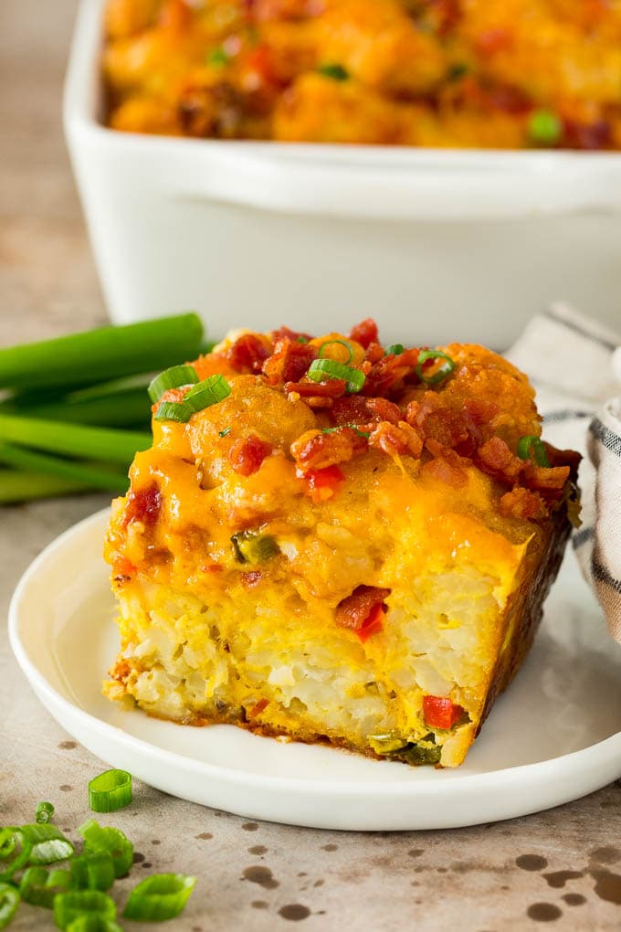 A slice of tater tot breakfast casserole on a plate.