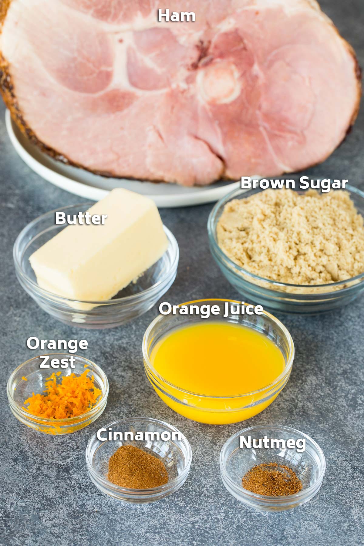 Ingredients including ham, orange juice, spices, brown sugar and butter.