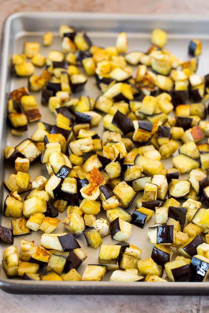 Roasted eggplant on a sheet pan.