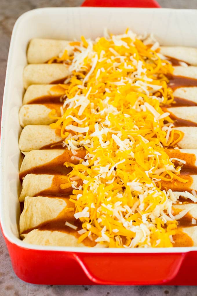 Easy Enchiladas ￼ Frozen chimichangas from Costco Green enchilada sauce  Jack cheese Onion (optional) Directions: Pour a littl…