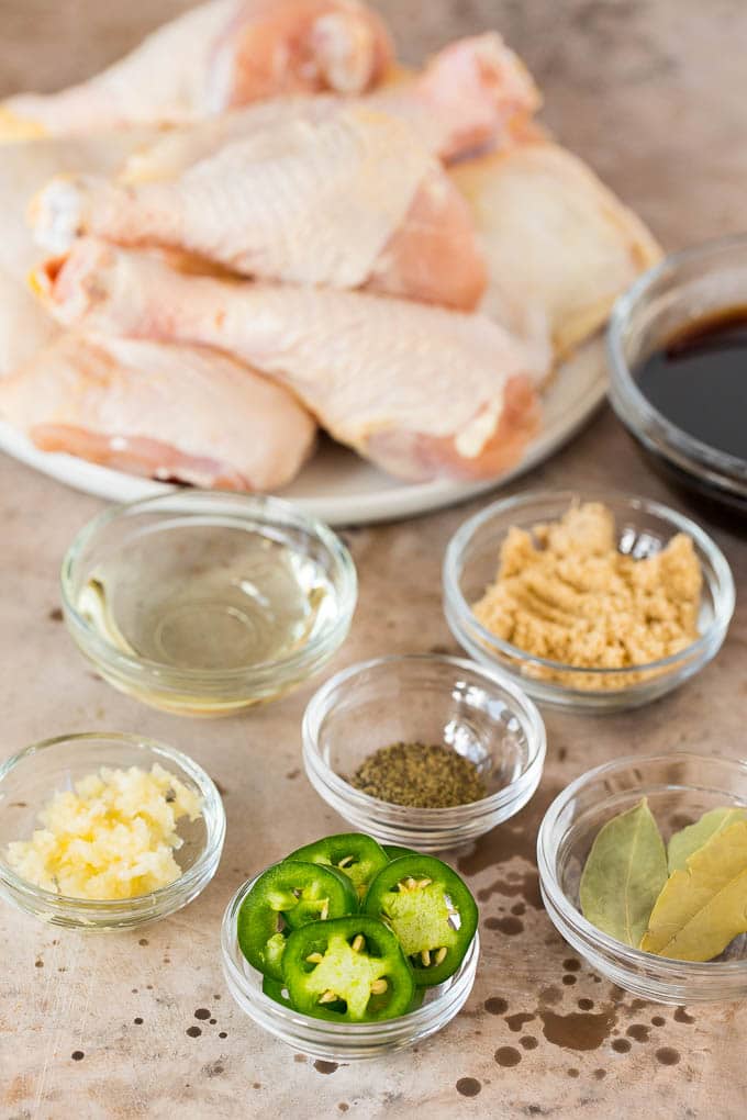 Small bowls of ingredients including jalapenos, brown sugar, garlic and bay leaves.