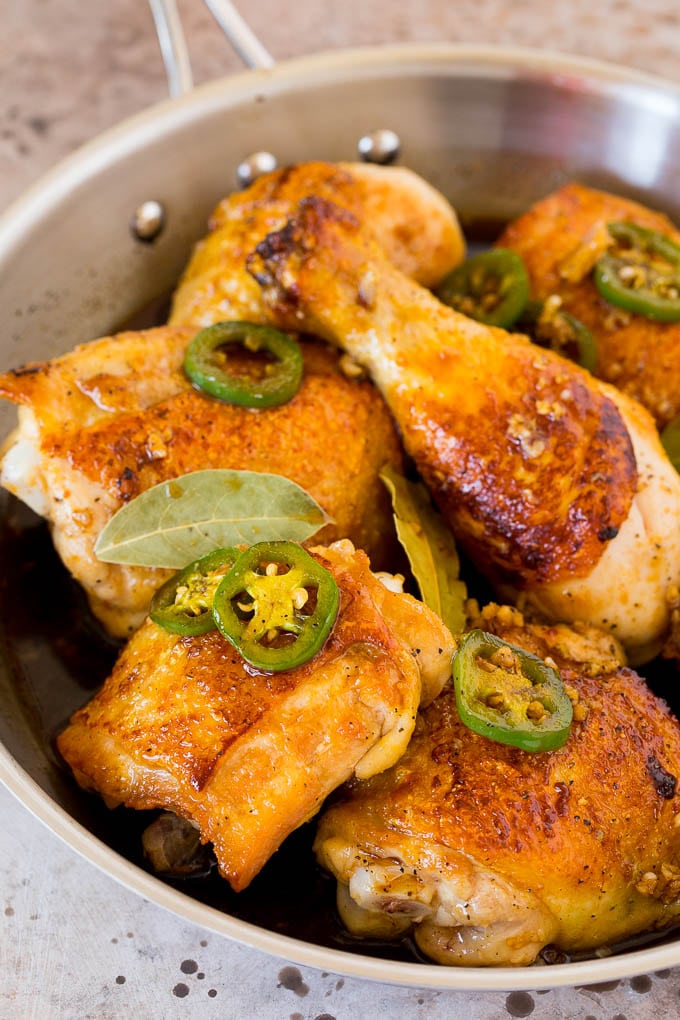 A pan of chicken with jalapenos, soy sauce and garlic.
