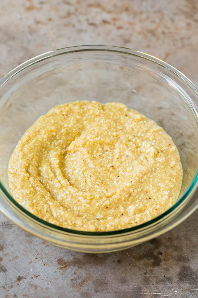 A mixture of matzo meal, eggs and seasonings in a bowl.