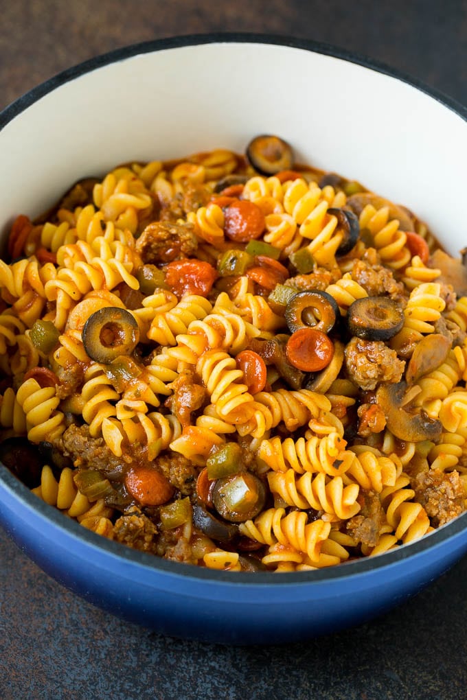 Cooked pasta with meat and vegetables in a pot.