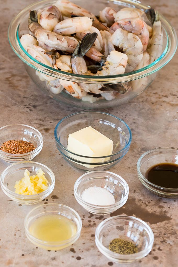 Bowls of ingredients including shrimp, butter and seasonings.