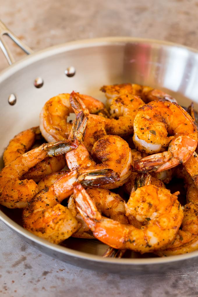 Cooked shrimp in a skillet.