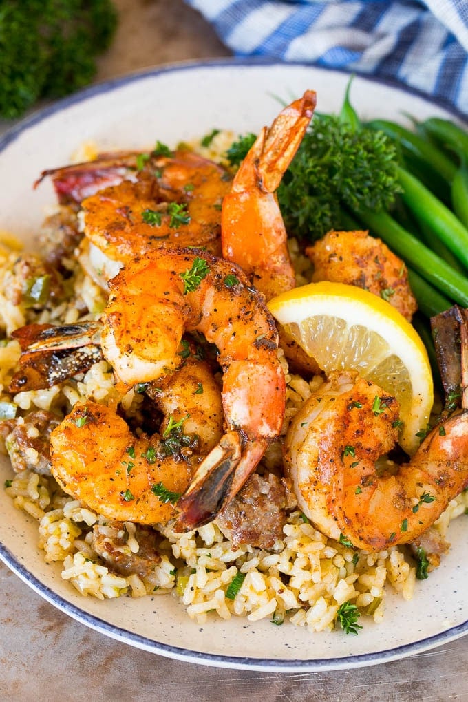 Cajun shrimp served over rice with green beans.