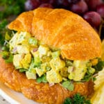 Curry chicken salad served on a croissant.