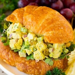 Curry chicken salad served on a croissant.