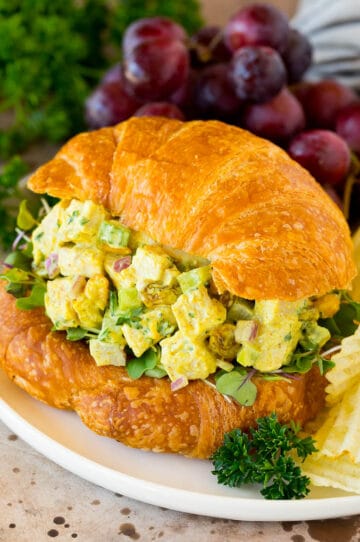 Curry chicken salad served on a croissant.