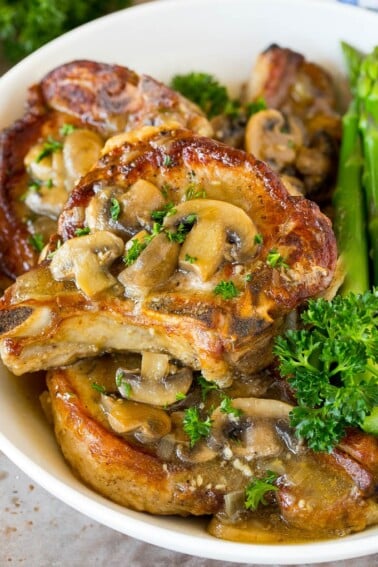 Instant Pot pork chops topped with mushroom gravy.