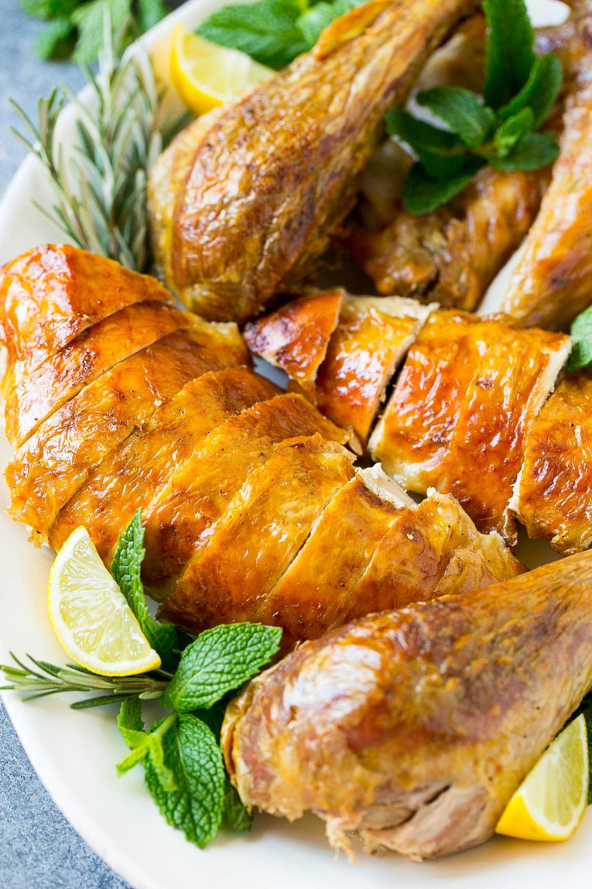 Sliced roasted turkey on a serving platter.