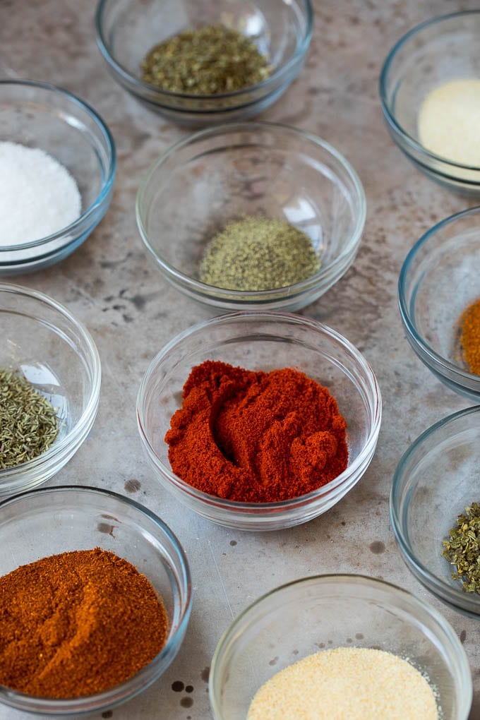 Small bowls of herbs and spices.