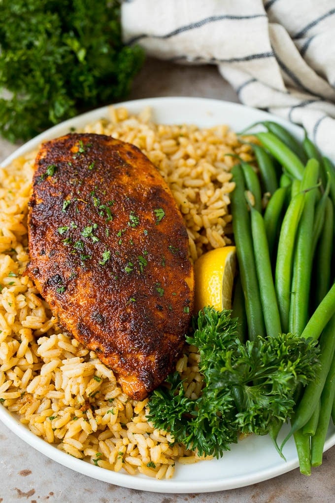 Blackened seasoning on chicken breast served over rice.