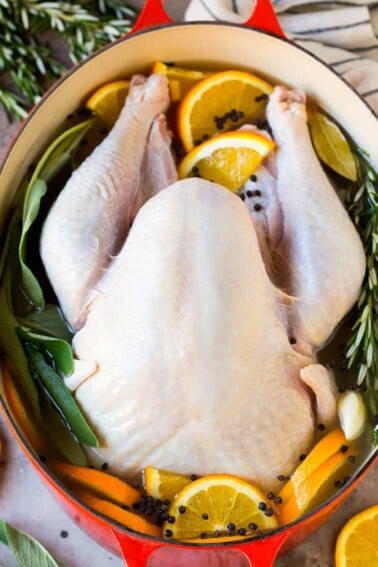 How to brine a turkey with a raw turkey in a pot of brine.