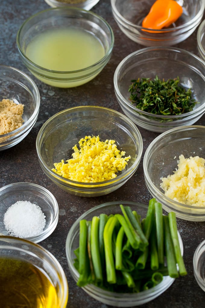Marinade ingredients in small glass bowls.