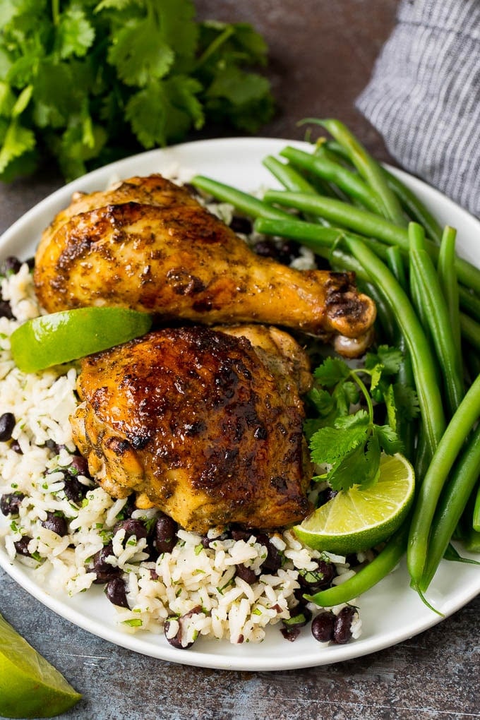 Jerk chicken marinade on cooked chicken over rice and beans.