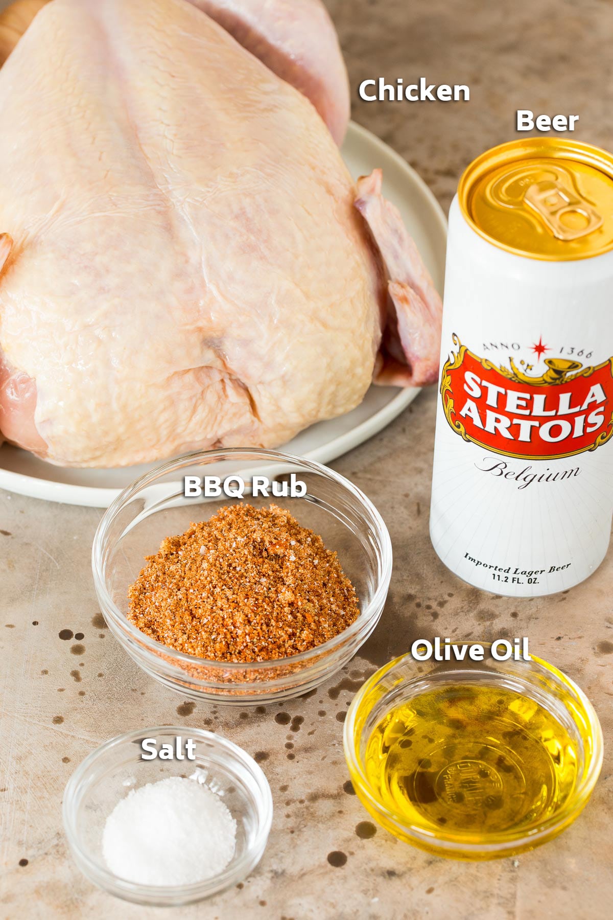 Ingredients such as chicken, olive oil, beer and spice rub.
