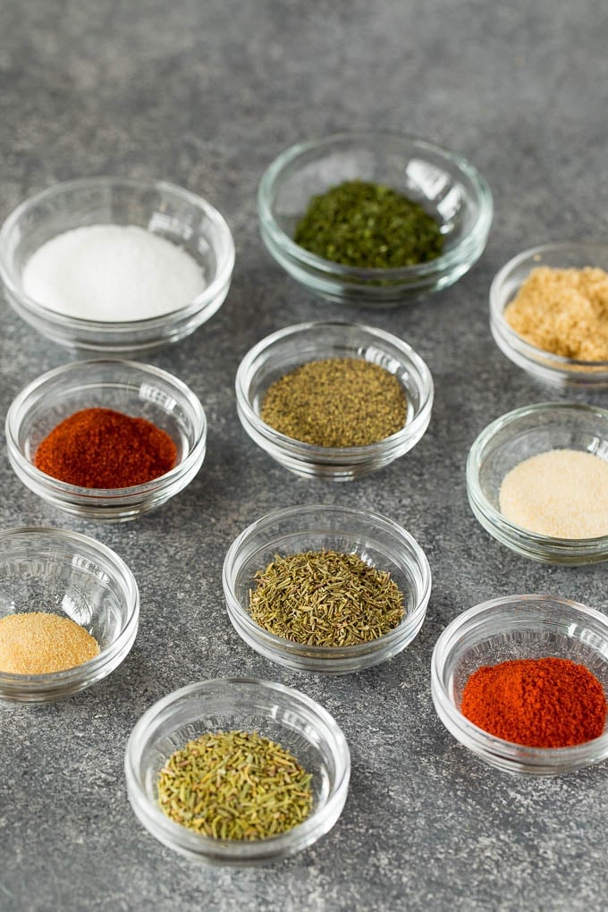 Small glass bowls of herbs and spices.