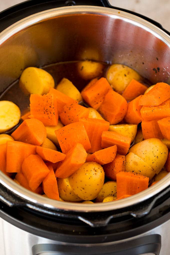 Carrots and potatoes in a pressure cooker.