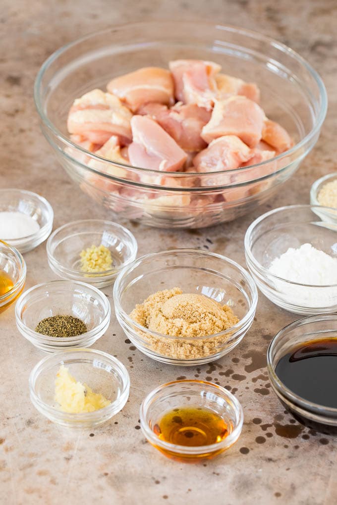 Bowls of ingredients including chicken, soy sauce, brown sugar and garlic.