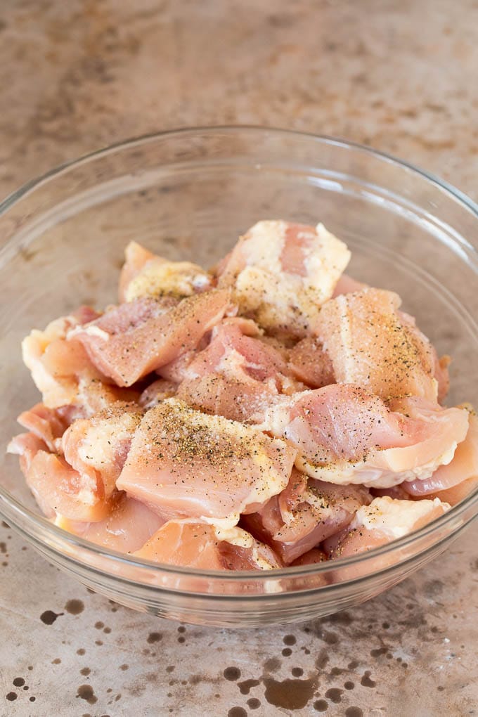 Diced chicken thighs seasoned with salt and pepper.