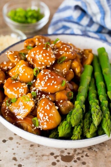 Instant Pot teriyaki chicken served with asparagus.