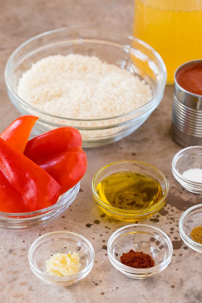 Bowls of rice, pepper, olive oil and seasonings.