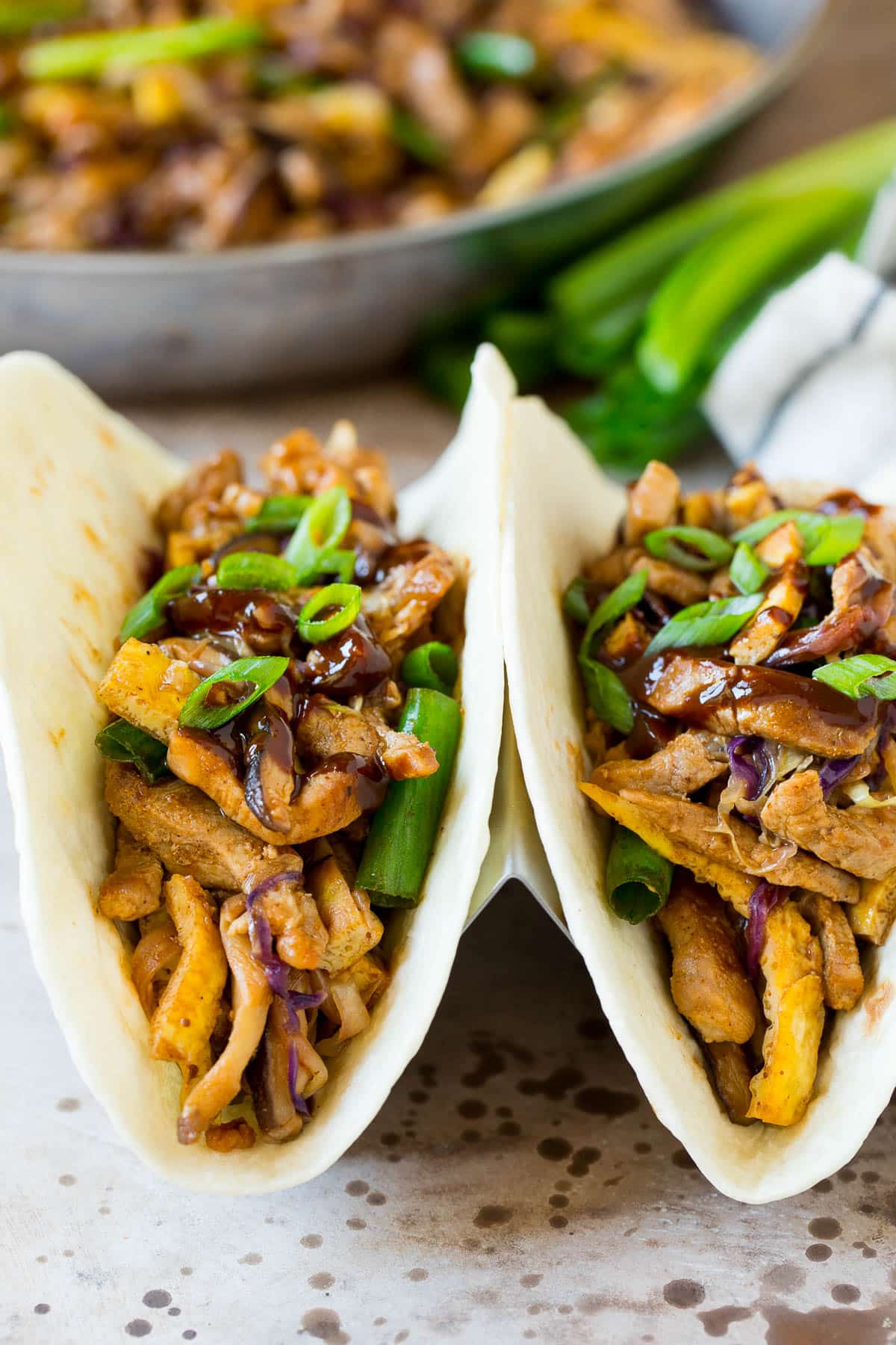 Moo shu pork served in tortillas with hoisin sauce.