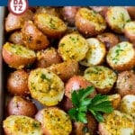 These oven roasted potatoes are baby potatoes coated in olive oil, garlic, herbs and parmesan cheese, then baked until golden brown.